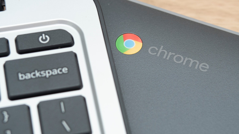 Backspace key from laptop on top of a Chromebook laptop
