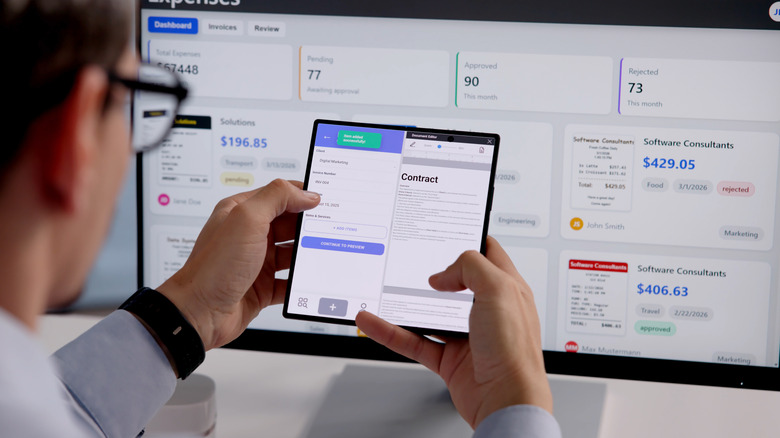 Man using foldable phone in split screen mode