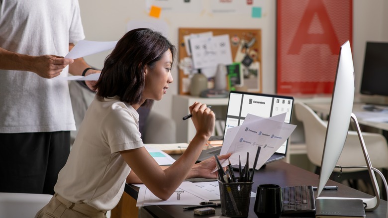 a person at a computer doing graphic design