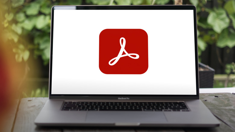 The Adobe Acrobat logo on a laptop
