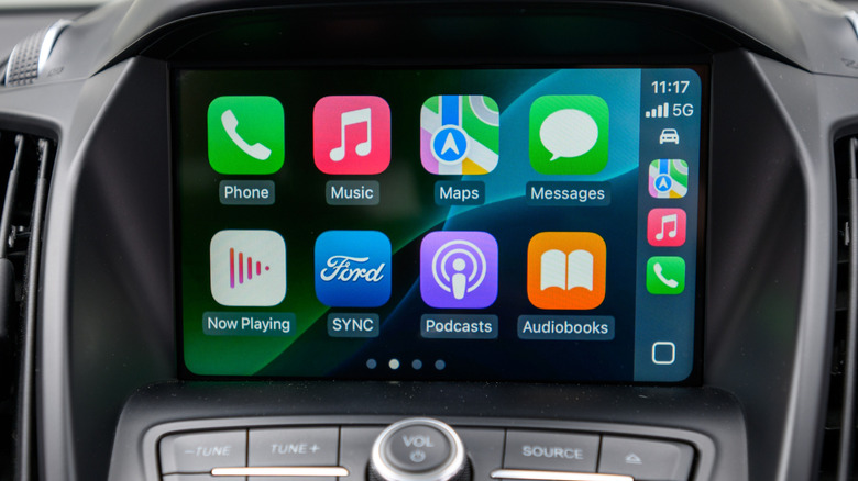 A vehicle's infotainment system displaying the Apple CarPlay dashboard