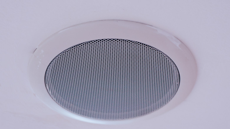 Close-up of a ceiling speaker