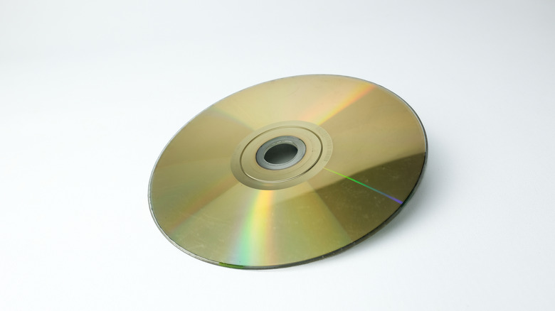 Gold recordable DVD disc on a white background.