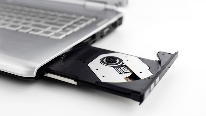 Laptop with its optical disc tray extended.