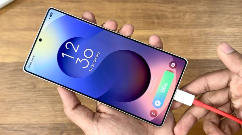 An Android phone connected to power.