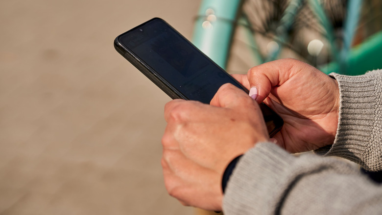 A close up shot of someone using a privacy screen protector
