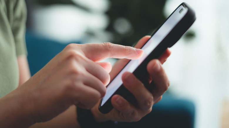 A person using a screen protector