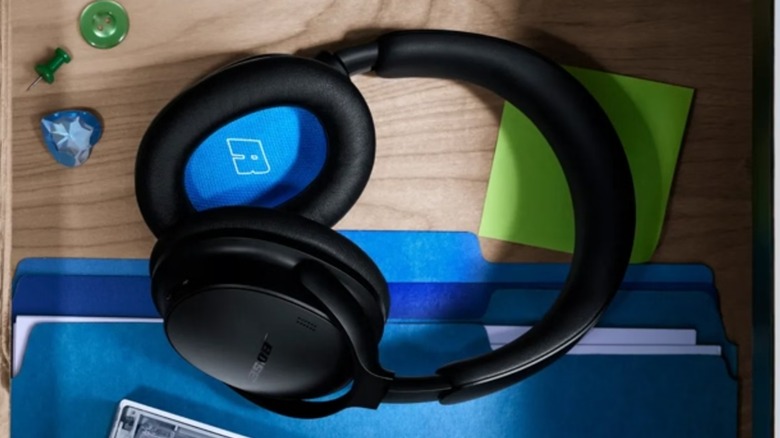 Black Bose QuiteComfort Headphones in wooden desk drawer