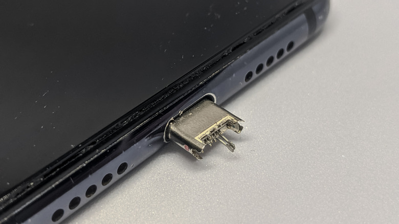 Broken USB plug in a smartphone