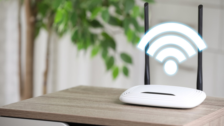 A router on a side table with a Wi-Fi icon displayed above.