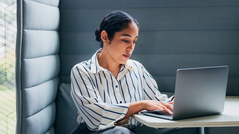 A woman using a laptop