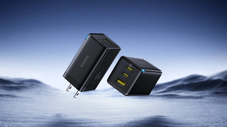 Two Baseus GaN5 Pro chargers floating over an arctic tundra landscape.