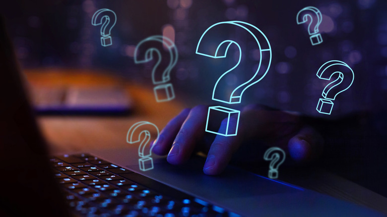 Illustration of question marks above a laptop keyboard