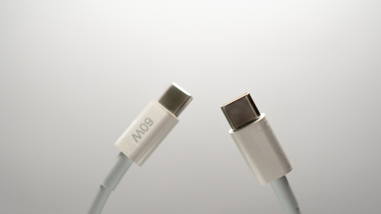 A USB-C cable with a 60W charging speed marking.