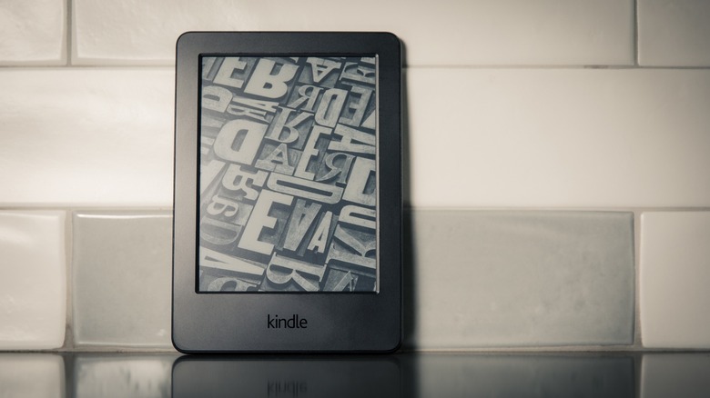 Kindle on a countertop showing default wallpaper