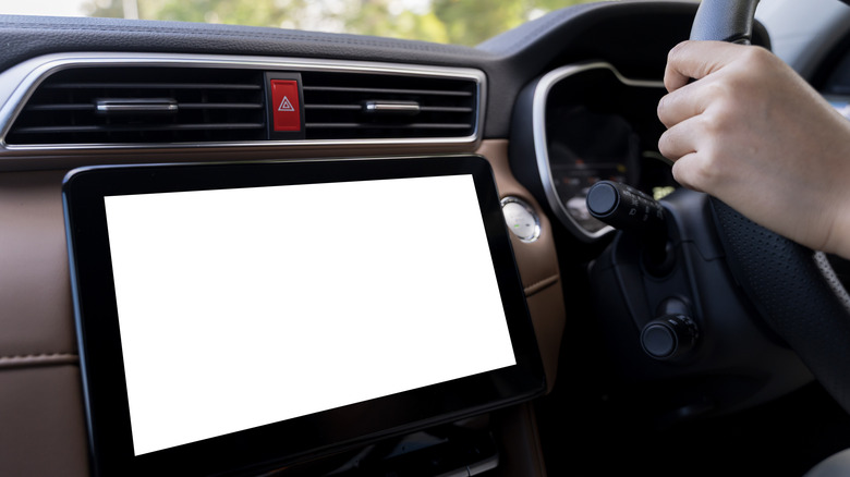 Android tablet mounted to dash with blank screen.