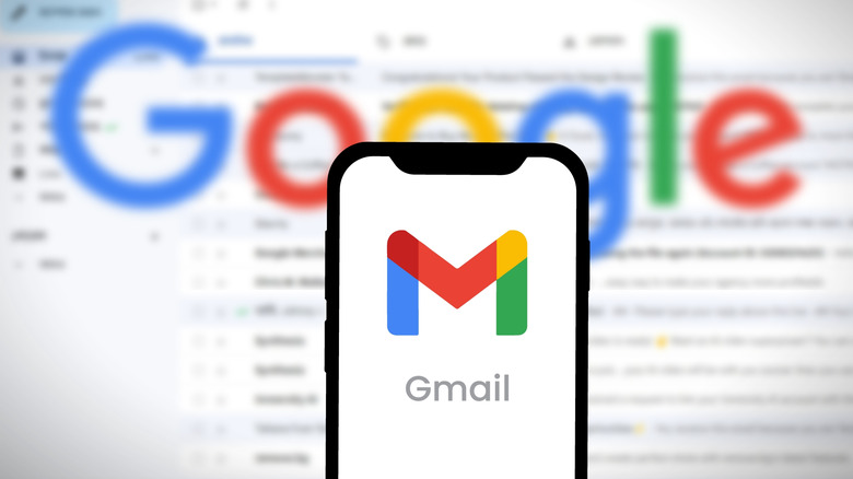Gmail on a smartphone with an inbox in the backdrop