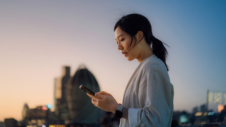 A woman staring at her phone