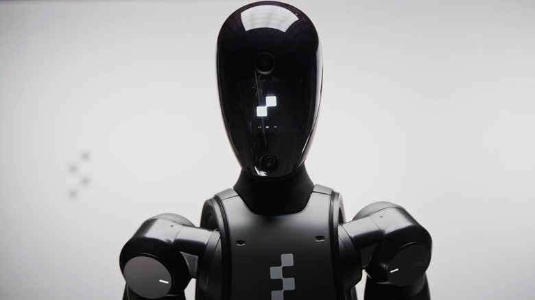 Figure 02 robot looking at camera on white background