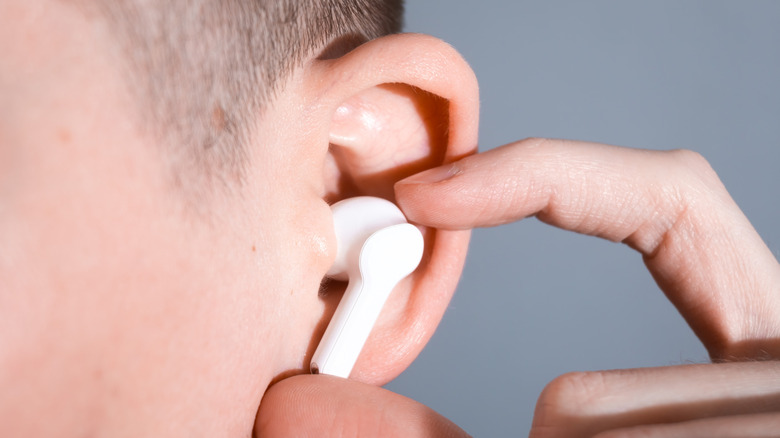 An earbud in a person's ear