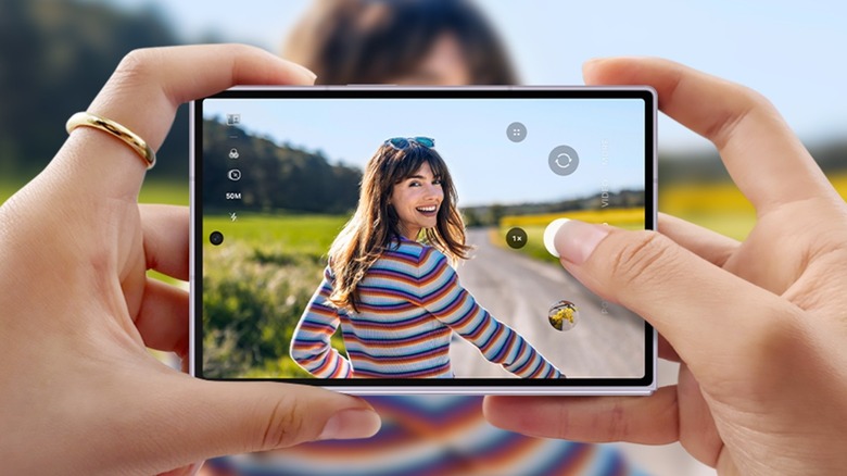 A person taking pictures of a woman with a Galaxy Z Fold8