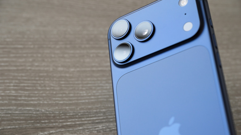 The iPhone 17 Pro on a gray surface.