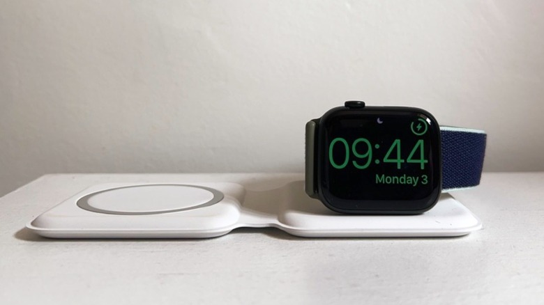An Apple Watch charging on a MagSafe Duo
