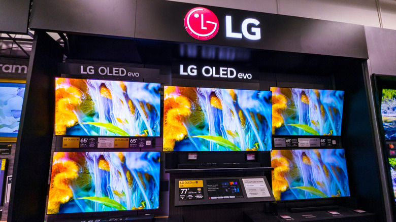 A retail display of LG OLED TVs.