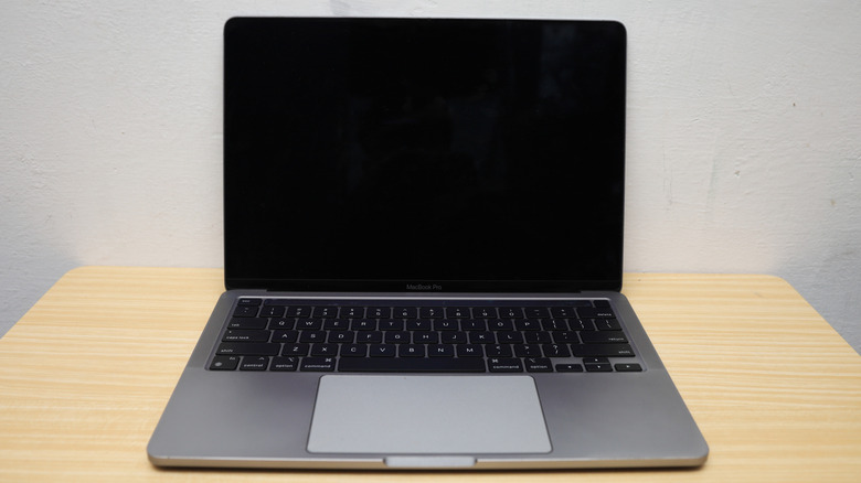A MacBook Pro with the black screen