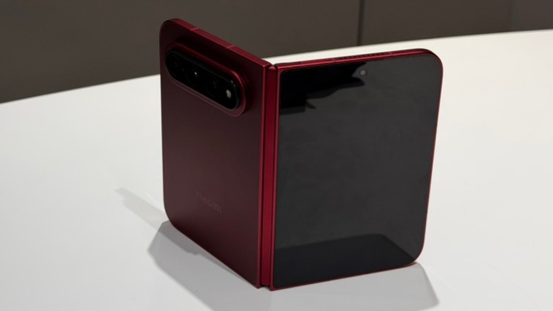 A Xiaomi 18 Fold standing open on a white desk
