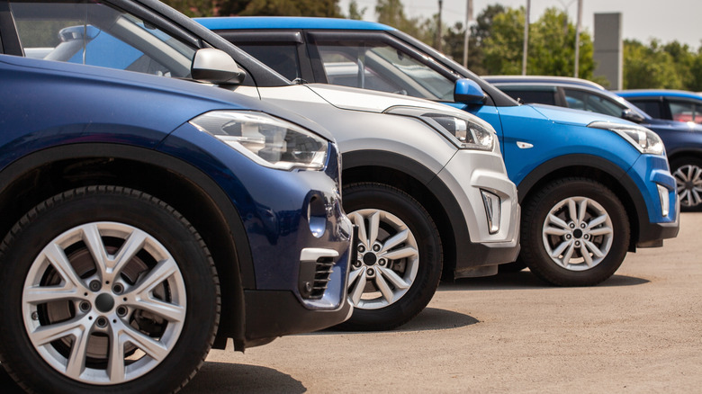 Electric vehicles lined up in a parking lot