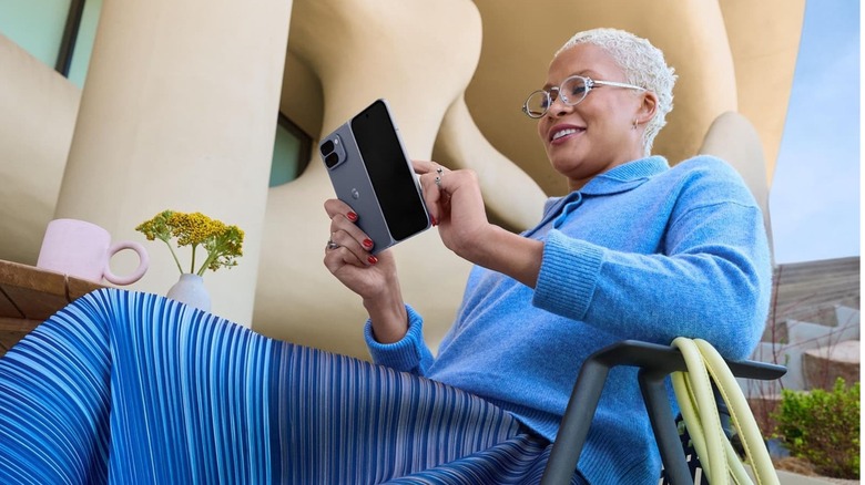 A person using a Pixel smartphone outdoors