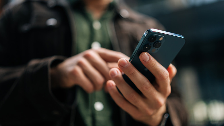 A person scrolling content on a smartphone.