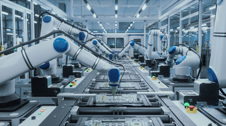 An electronics factory production line featuring robotic arms