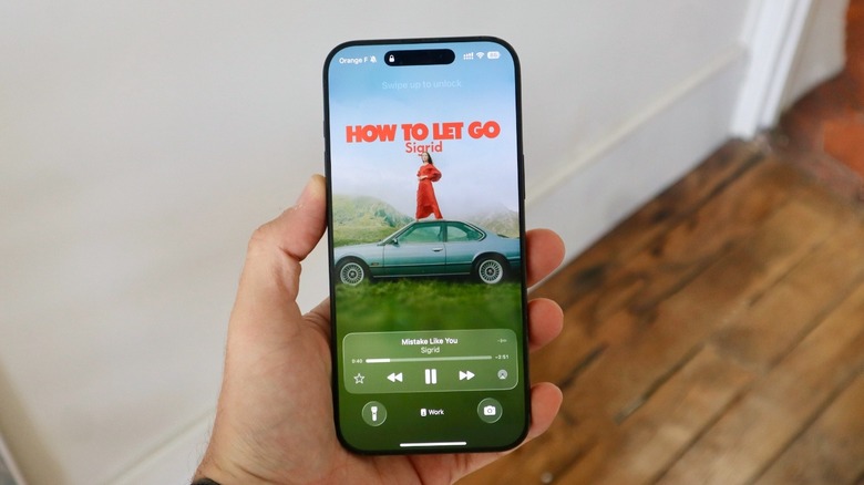 iOS 26 new Lock Screen with Apple Music animated cover