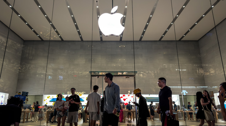 An Apple logo outside an Apple retail store.