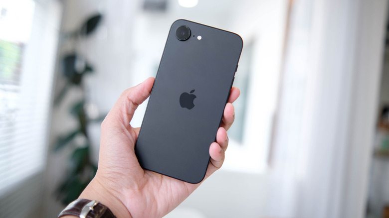 Someone holding an iPhone 16e