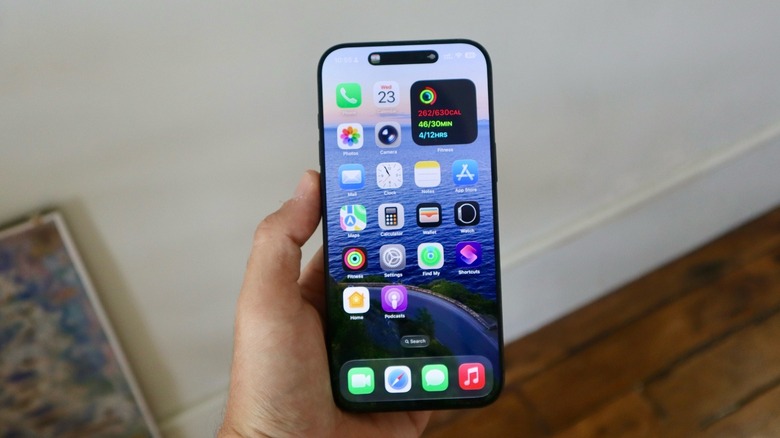 A hand holding an iPhone