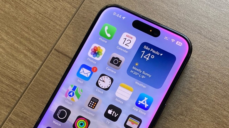 Close-up shot of an iPhone with the Apple Intelligence glow on its bezels