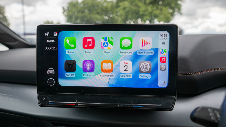 New iOS 26 version of Apple CarPlay showcasing translucent Liquid Glass UI elements widgets and compact notification styles.