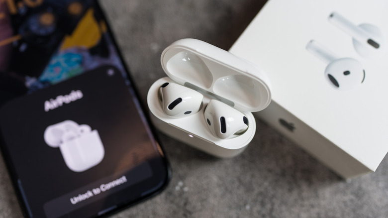 AirPods 4 connecting to an iPhone.