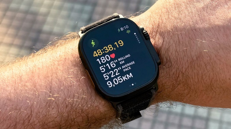 A man wearing an Apple Watch Ultra 2 while it records a run workout