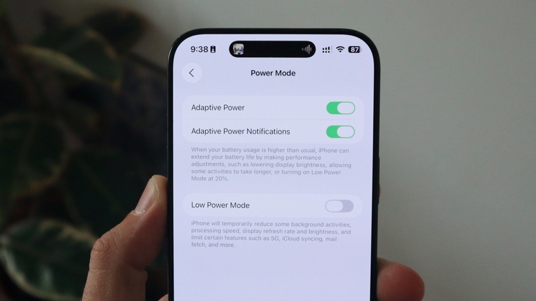 An iPhone 16 Pro Max displaying the new Adaptive Power mode for iOS 26