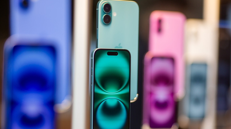 iPhone 16 models on display in a store.