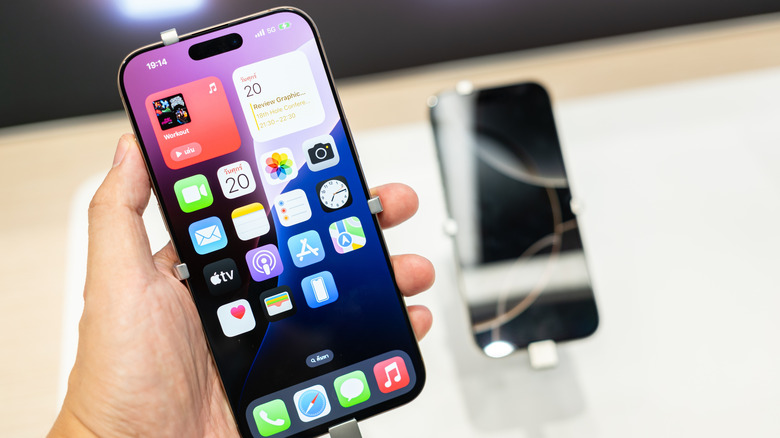 iPhone 16 Pro Max in hand.