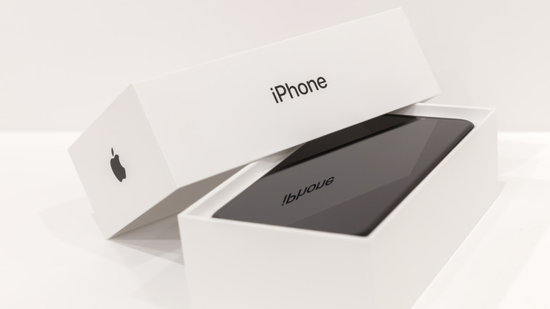 New black iPhone in its retail box opened slightly displaying phone