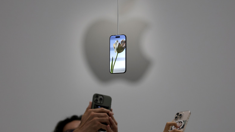 The iPhone 17 Pro display against the backdrop of the Apple logo.
