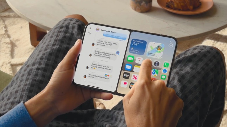 Person scrolling through apps on the iPhone Duo
