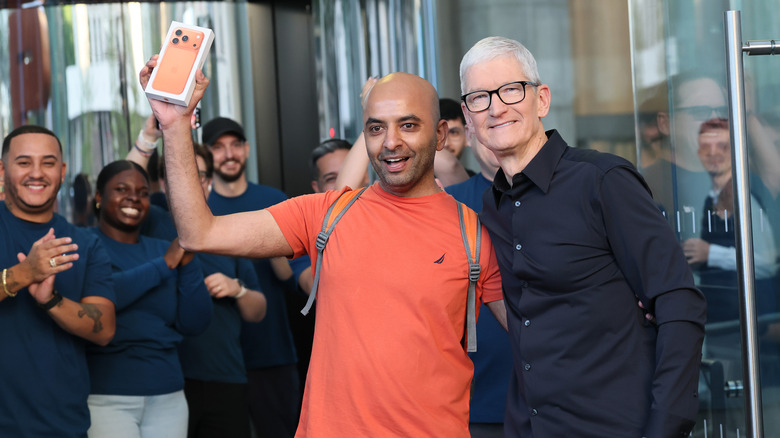 Apple's CEO Tim Cook with customer at the release day of the iPhone 17 Pro models