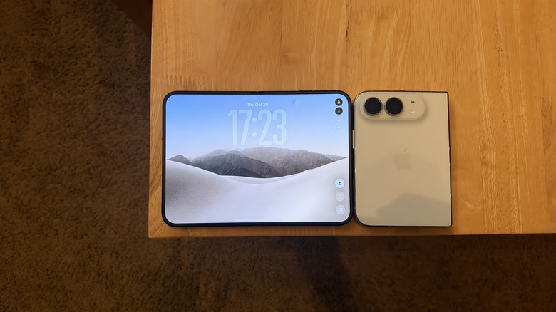 iPhone Duo unfolded and folded on a wood table
